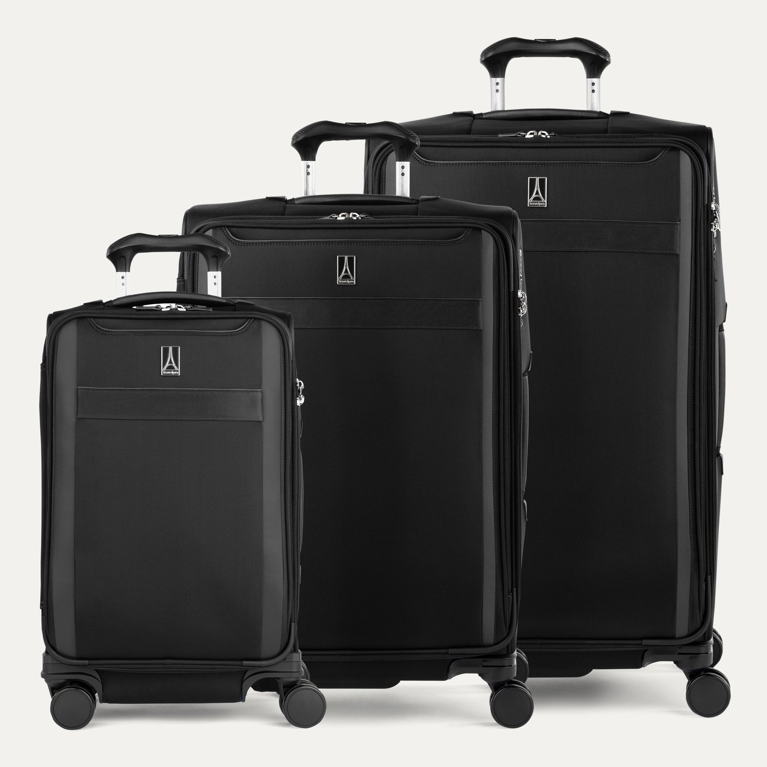 A set of three black VersaPack+ expandable spinner suitcases in carry-on, medium, and a large size