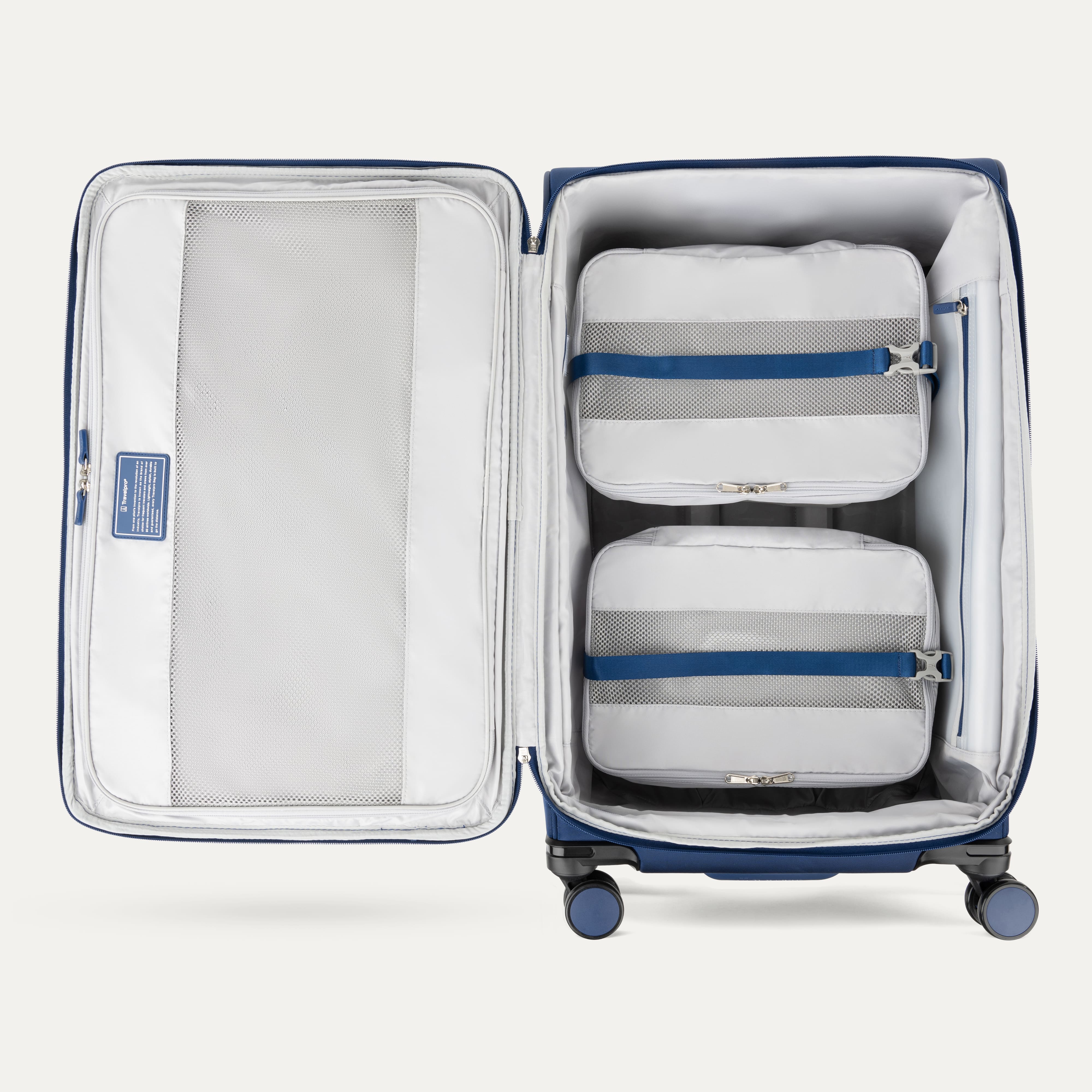 Water Resistant Interior of Blue VersaPack+ Extra Large Checked Luggage Spinner with Compression Packing Organizers