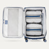 Water Resistant Interior of Blue VersaPack+ Extra Large Checked Luggage Spinner with Compression Packing Organizers