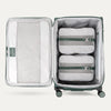 Interior of Green VersaPack+ Extra Large Checked Luggage Spinner with Compression Packing Cubes and Accessories