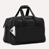 Slanted rear view of Travelpro Altitude Double Expansion Duffel in Jet Black with phone in QuickSlip Pocket, top handle, and dual straps.