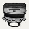 Open front pocket view of the Travelpro® Altitude™ Full Expansion Brief in black, showing an organized interior with a zippered pocket and multiple divided compartments for accessories.