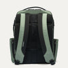 Back view of a green and black backpack on a white background