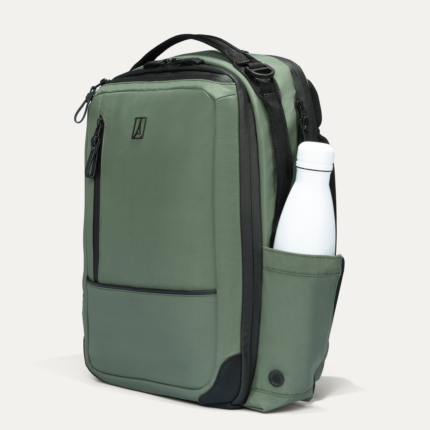 Green backpack with a water bottle in a pocket on a light gray background