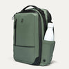 Green backpack with a water bottle in a pocket on a light gray background