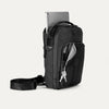Front-right view of the Travelpro Altitude Crossbody 6L in Black, featuring a tablet compartment and key leash.