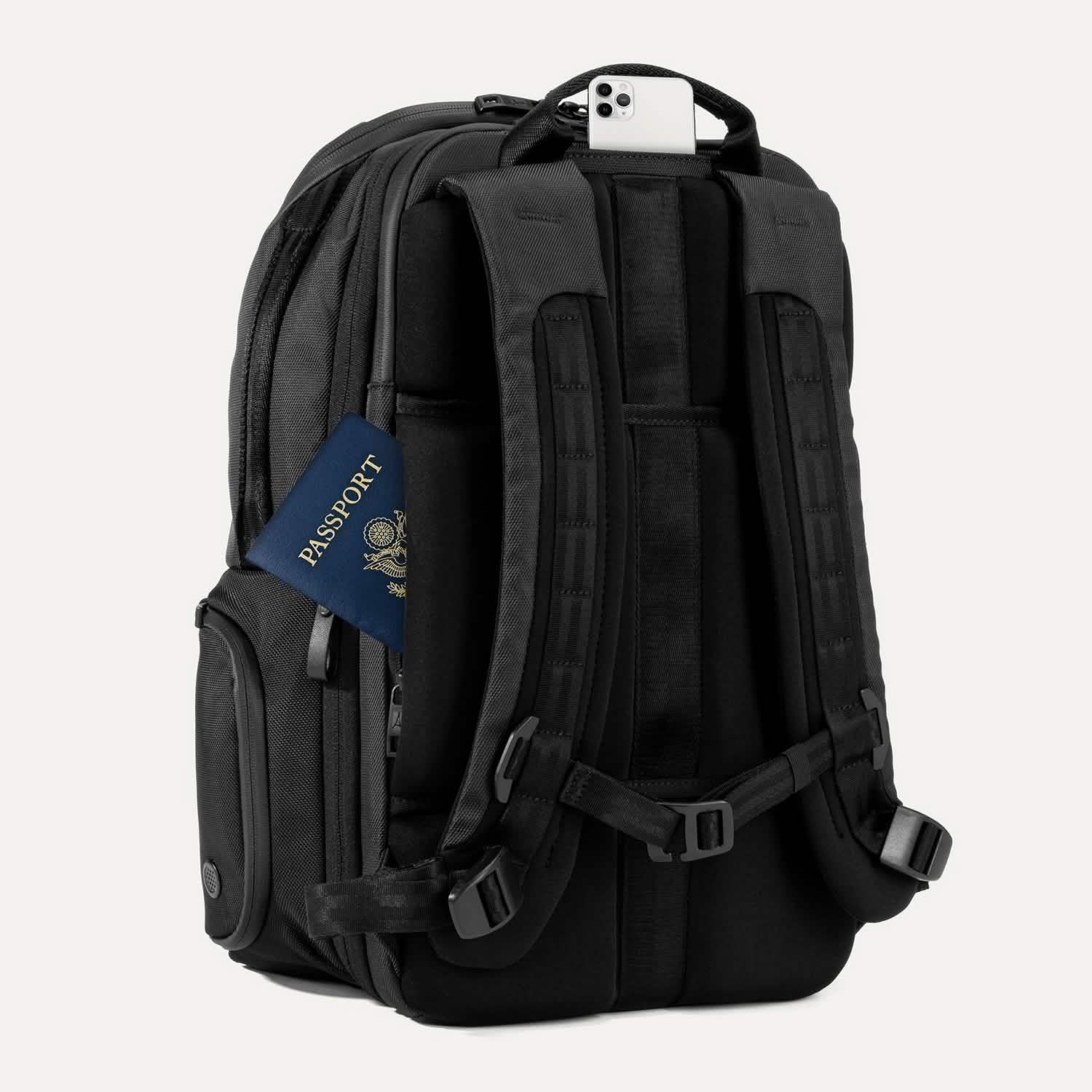 Rear view of Travelpro Altitude All-Purpose Laptop Backpack in Jet Black, featuring padded straps and QuickSlip Pocket with phone.