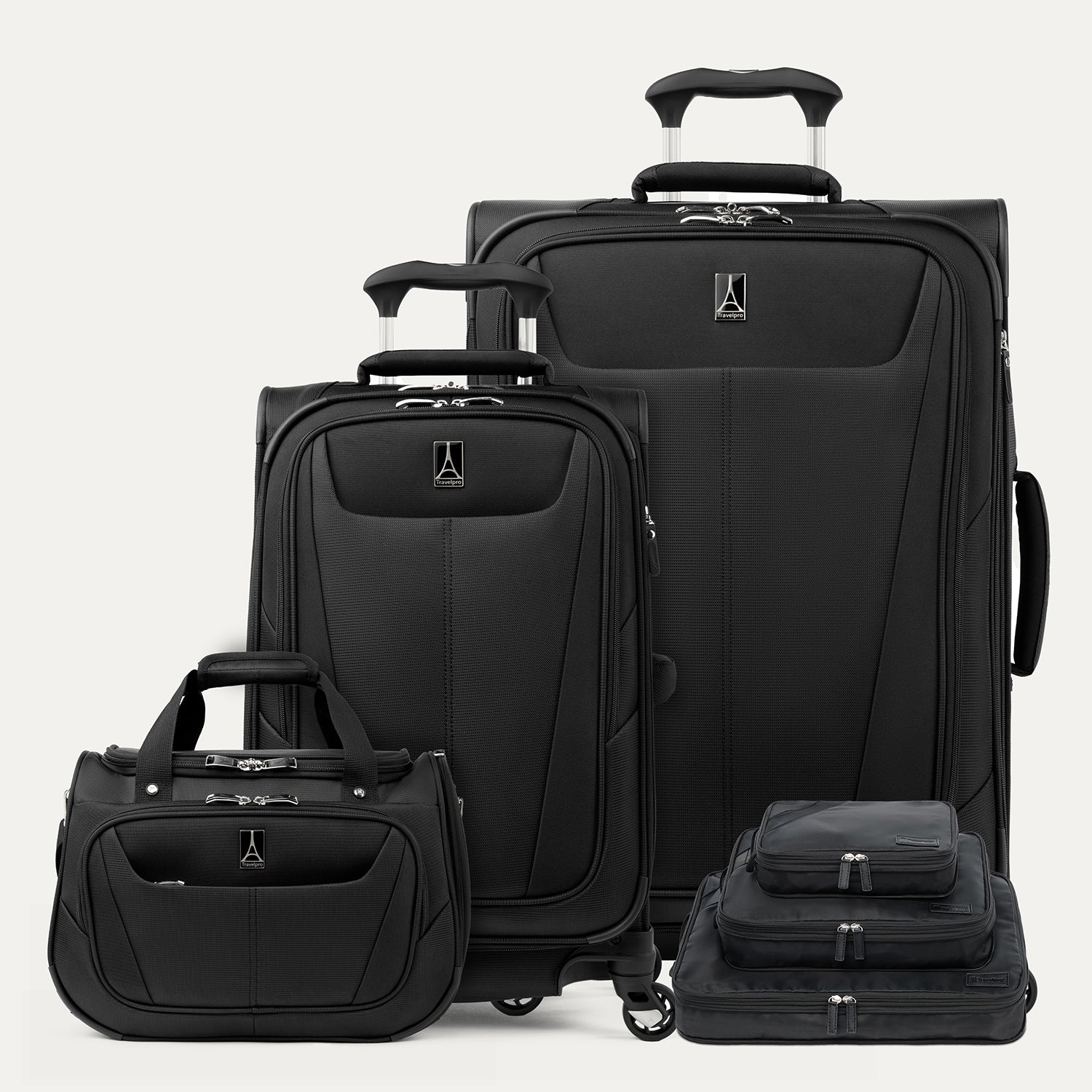 Set of black suitcases of different sizes on a white background