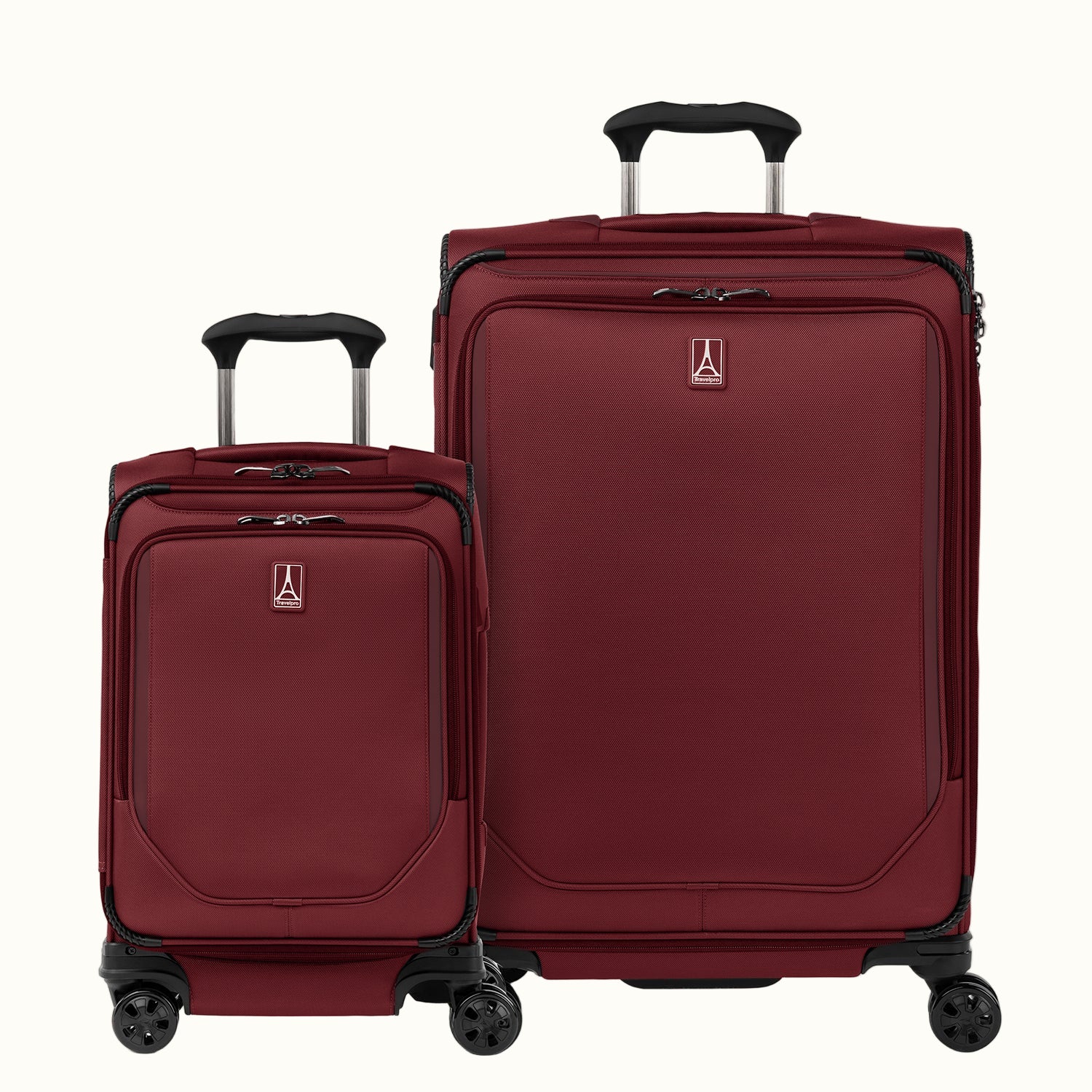 A set of two red spinner suitcases, one carry-on and one medium check-in size, with the travelpro logo on the front.