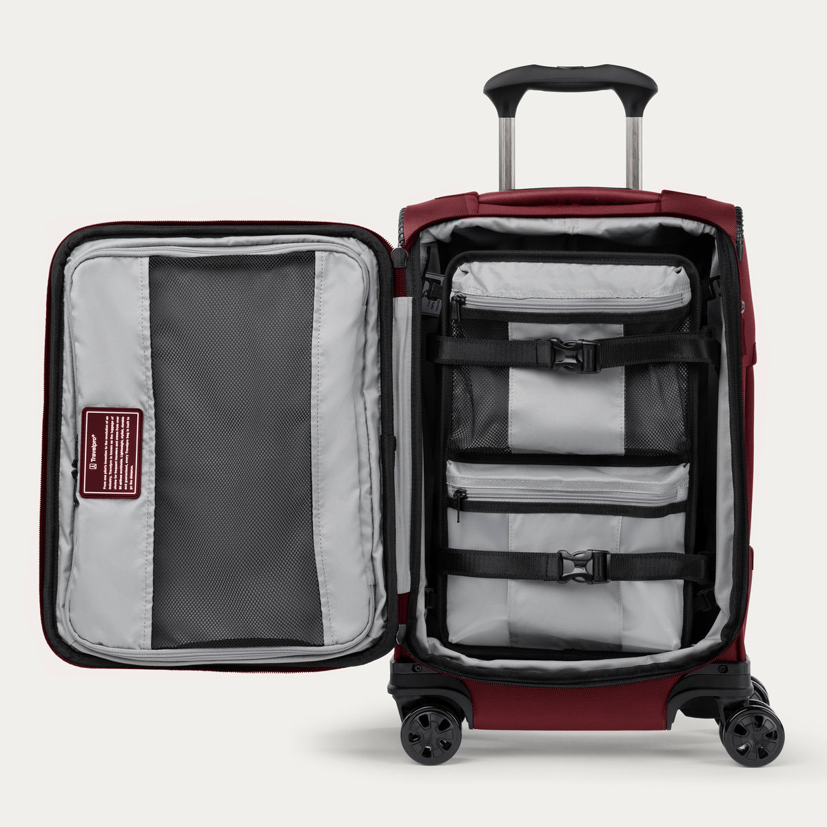 Red open suitcase with organizer strap down on a white background