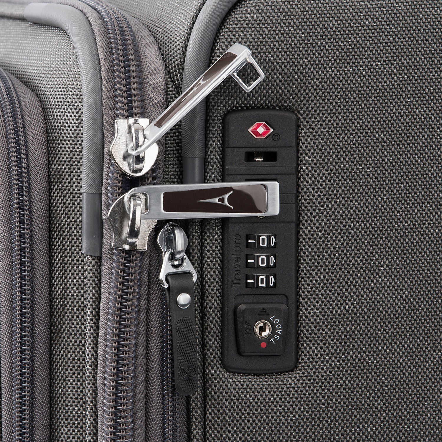 Close-up of a suitcase's lock and zipper mechanism.