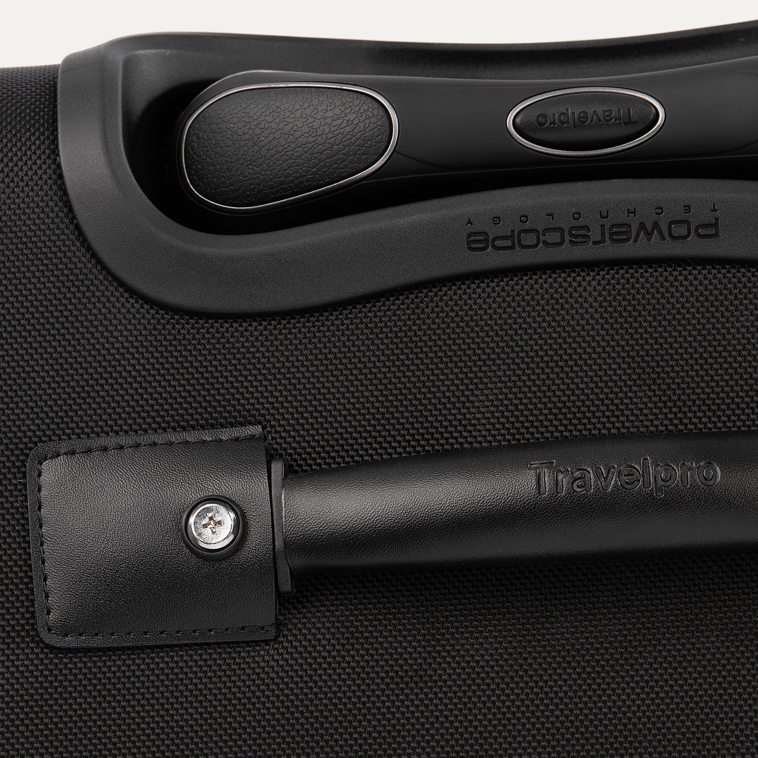 Close-up of a black suitcase handle and latch.