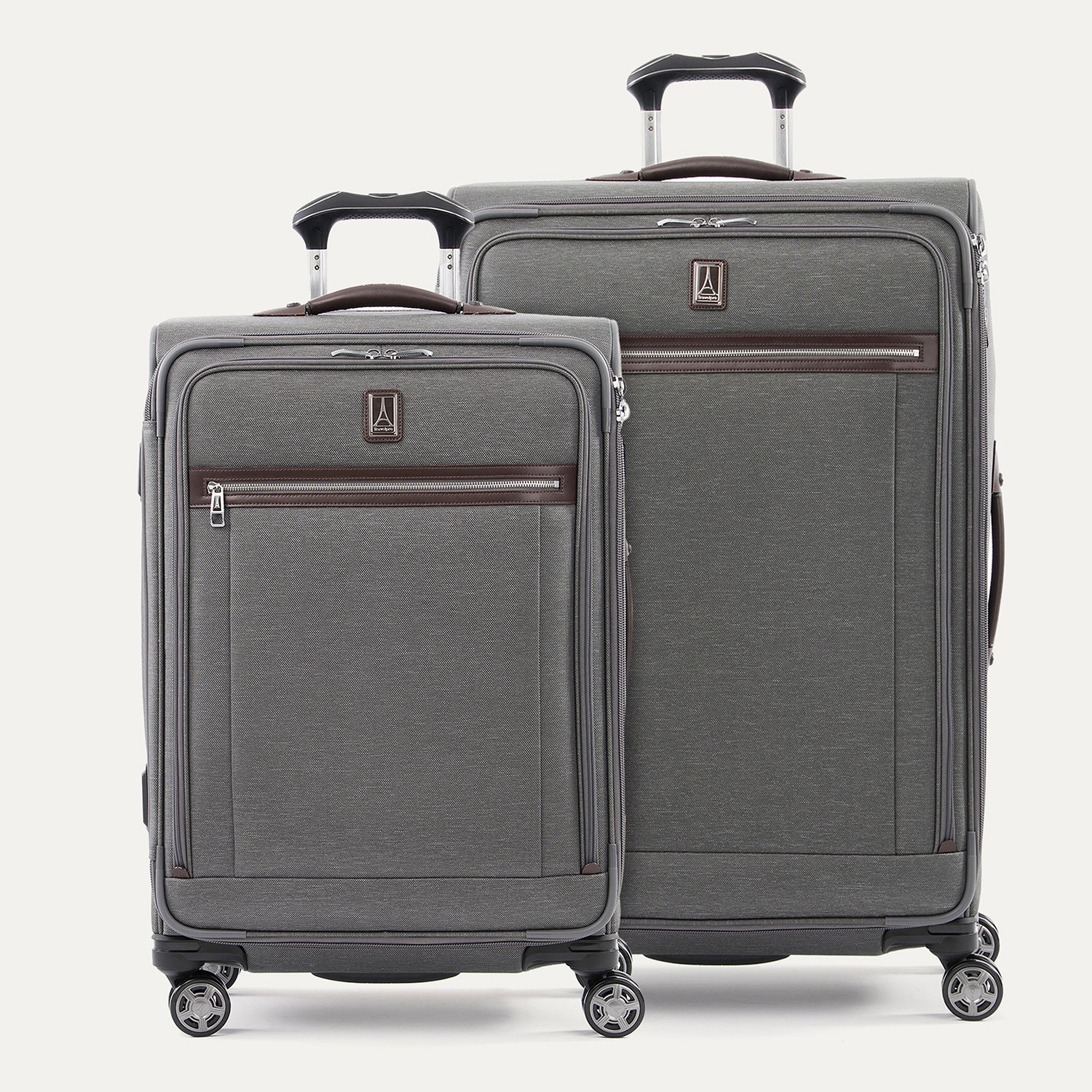 A set of two gray suitcases with spinner wheels and a power scope handle, branded with travelpro logo.