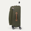 Green suitcase with brown handle on a white background