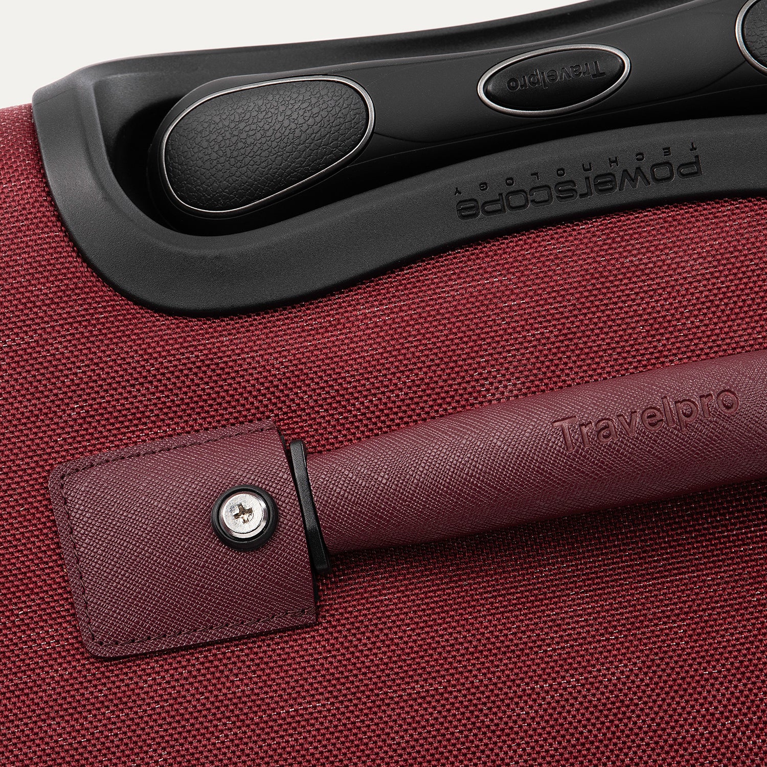 Close-up of a red suitcase handle