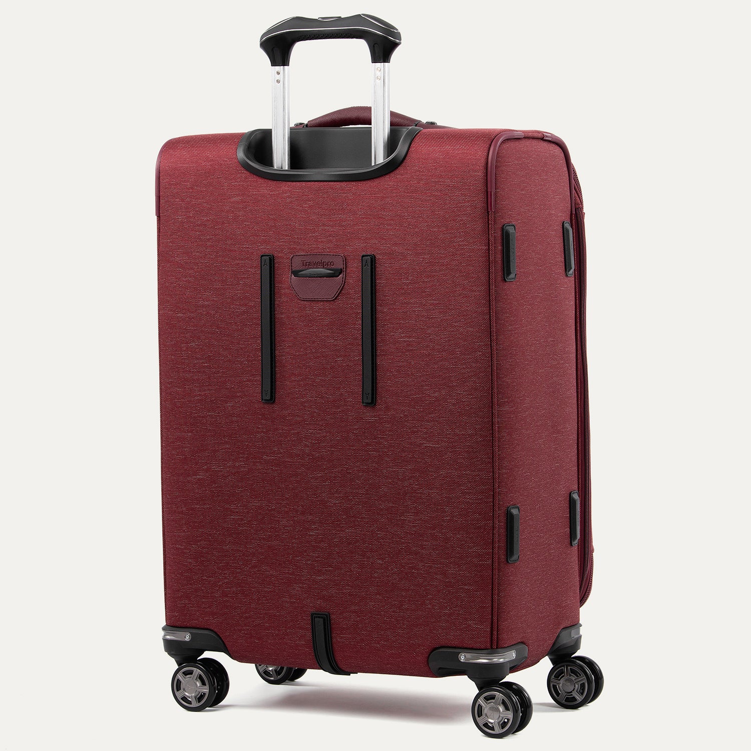 Red suitcase with black handles and wheels on a white background