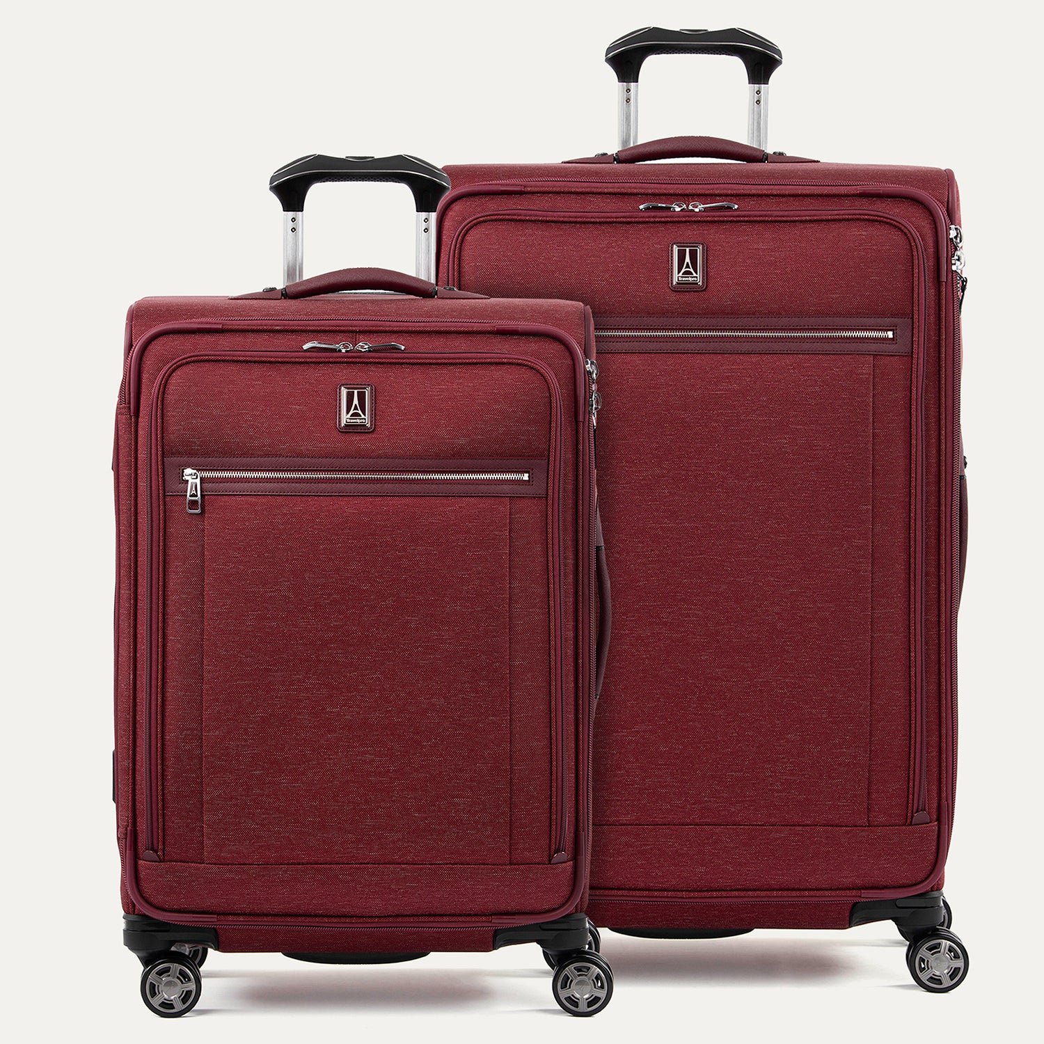 A set of two red softside spinner suitcases, with the Travelpro logo on a white background