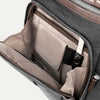 Open front compartment of a grey backpack on a white background.
