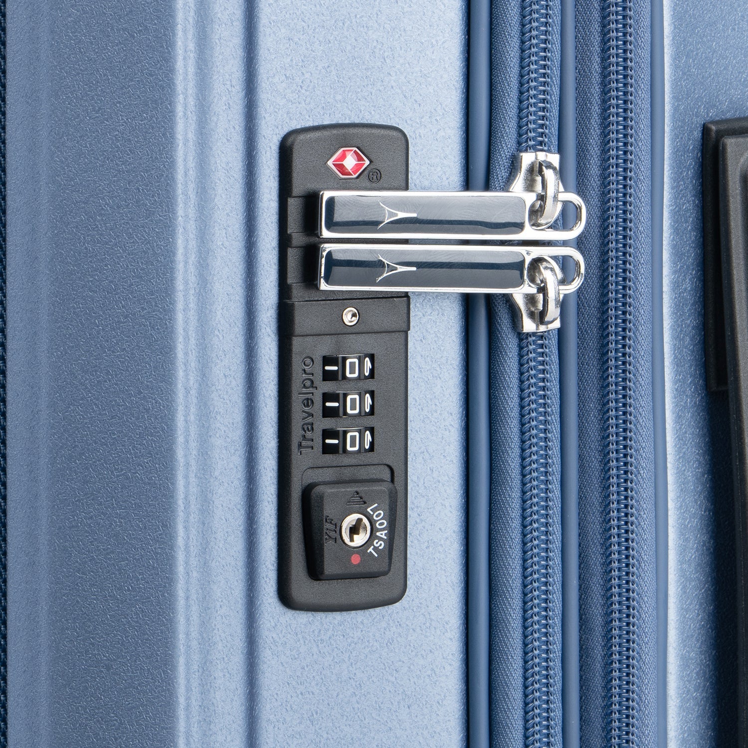 Close-up of a blue suitcase with a combination lock