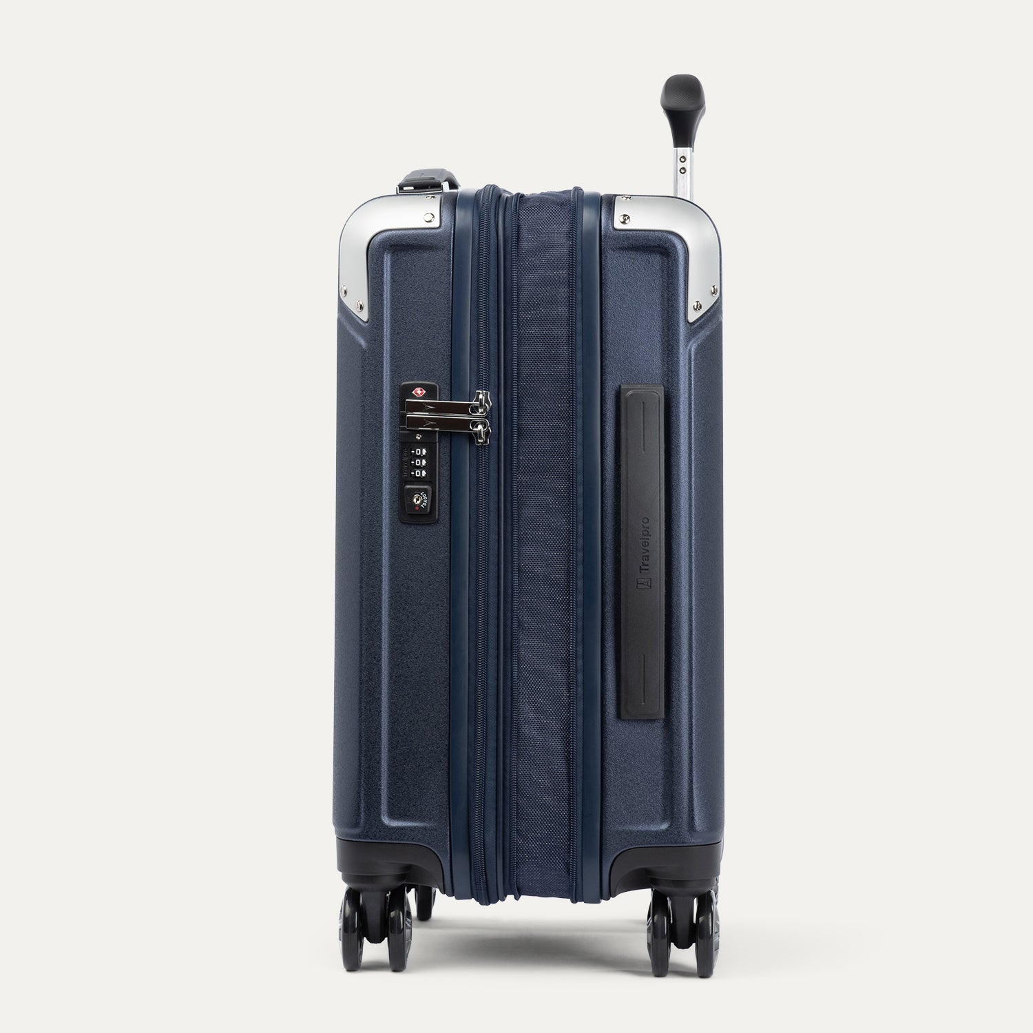 Side view of navy blue suitcase with handle and wheels on a white background