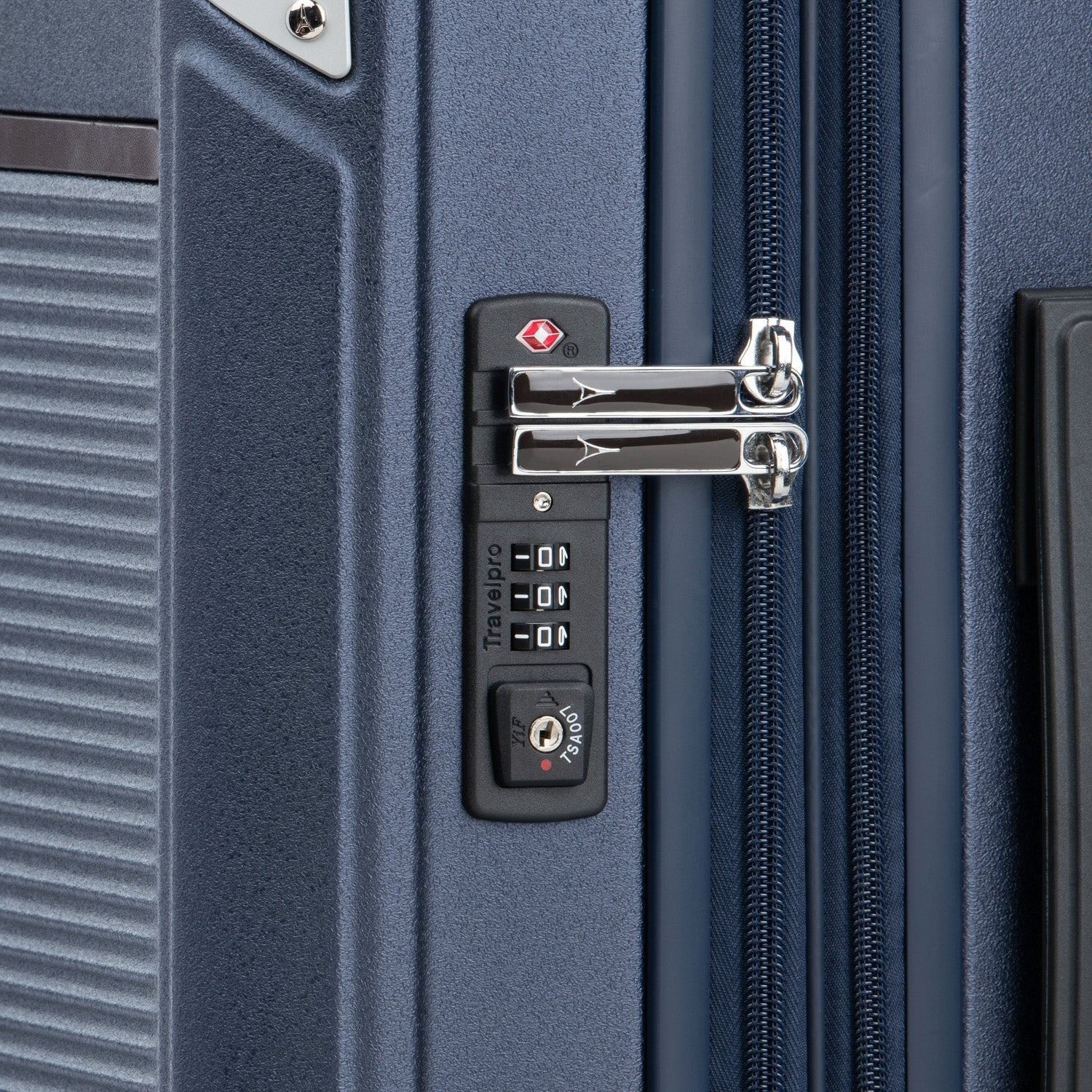 Close-up of a blue suitcase with a lock mechanism