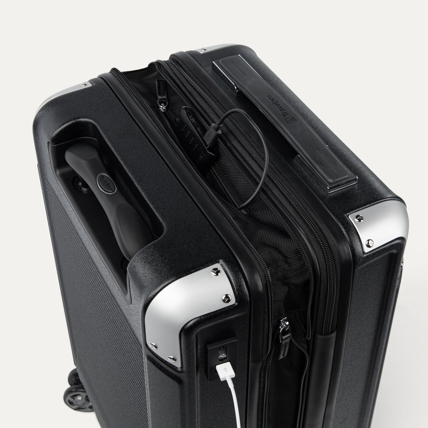 Top view of Travelpro Platinum Elite Hardside Spinner in Black, showing USB Charging Port and built-in battery pocket