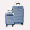 A set of two blue hardside spinner suitcases, one carry-on and one check-in size, with wheels and a TSA lock.