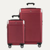 A set of two red hardside spinner suitcases, one carry-on and one check-in size, with the travelpro logo visible