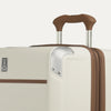 Close-up of Travelpro Platinum Elite Hardside Spinner in Cream White, highlighting the PowerScope Extension Handle and aluminum corner guard.