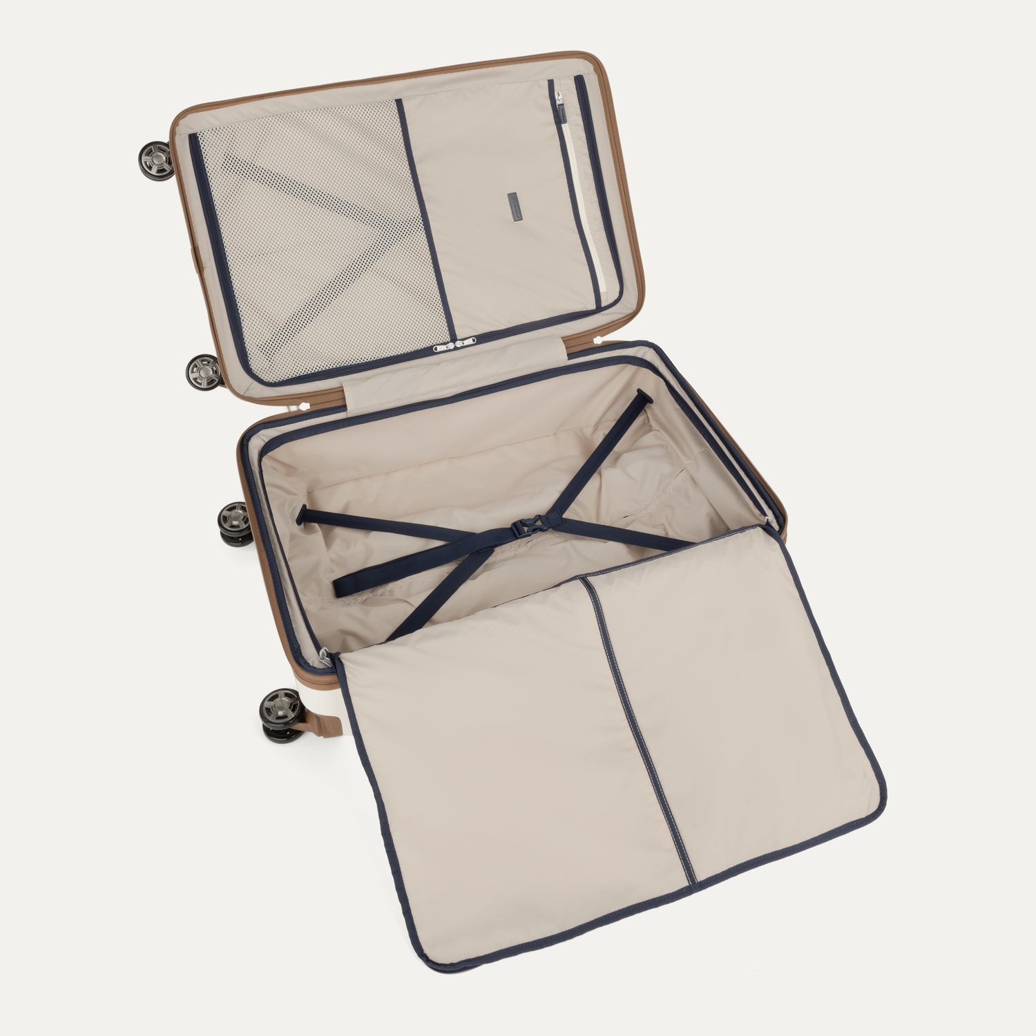 Interior view of Travelpro Platinum Elite Hardside Spinner in Cream White, featuring zippered divider panel and adjustable hold-down straps.