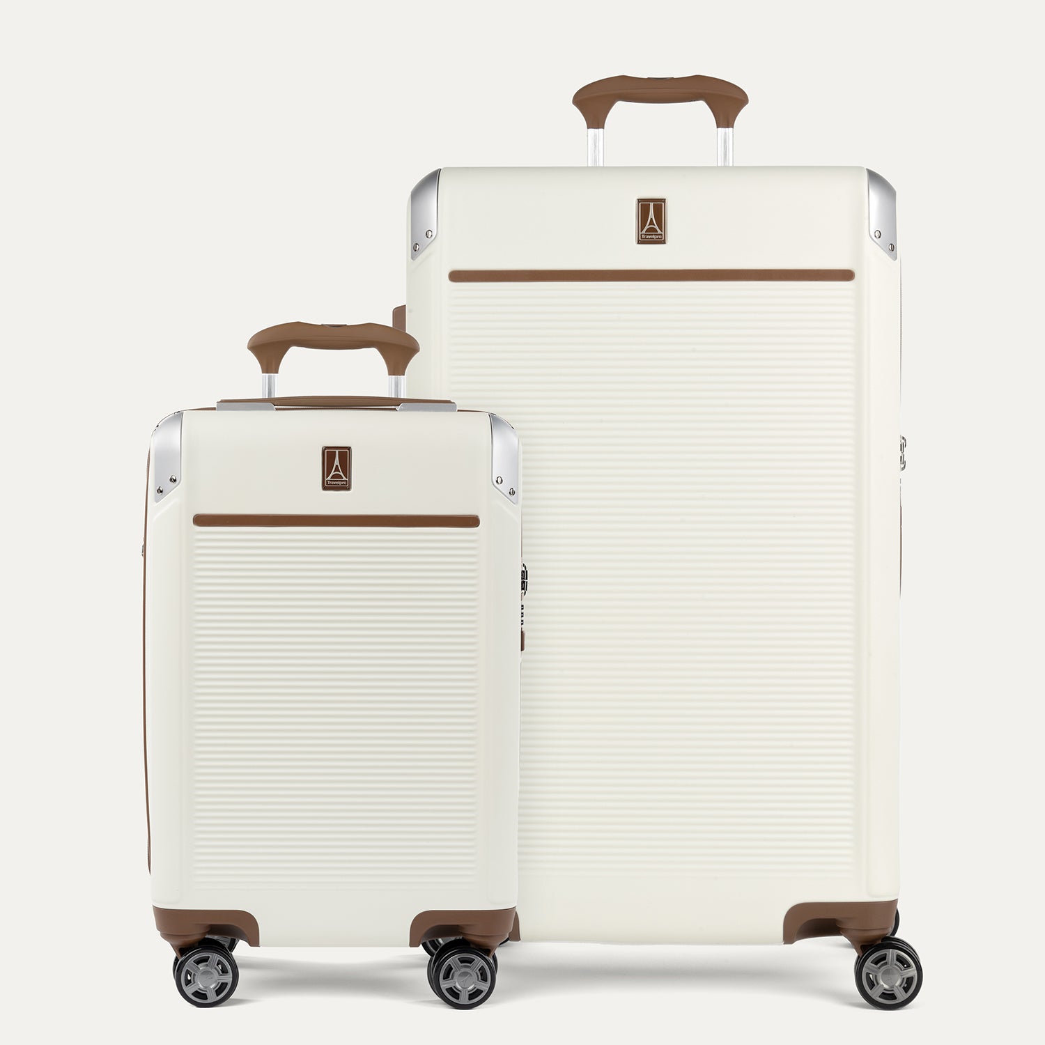 A set of two Platinum Elite hardside spinner suitcases in cream white color, including a carry-on and a larger check-in size, both with brown accents and aluminum corner armor.