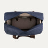 Blue weekender bag showing the interior on a light gray background