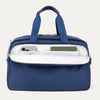 Blue tote bag with interior compartments on a light gray background