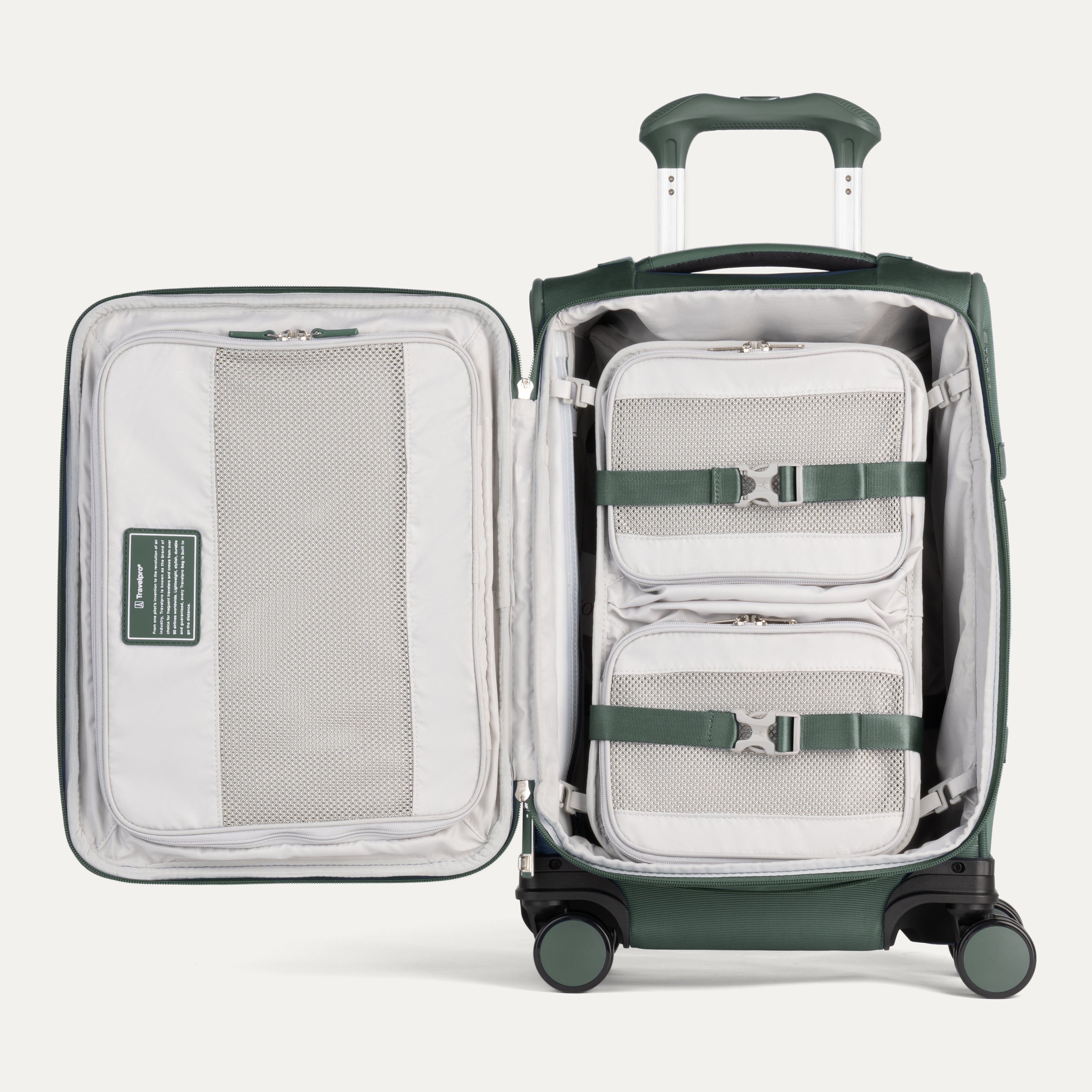 Green suitcase with open compartment showing packing cubes on a light gray background