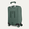 Green suitcase with wheels and handle on a light gray background