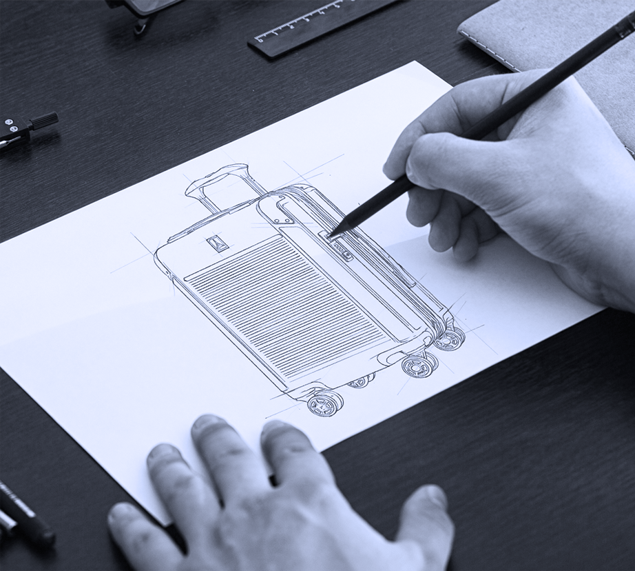 man sketching a drawing of  hardside luggage