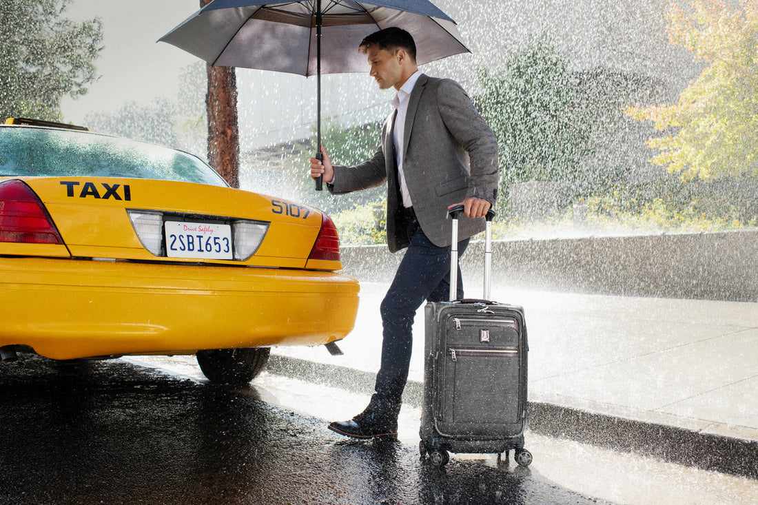man walking to taxi in the rain