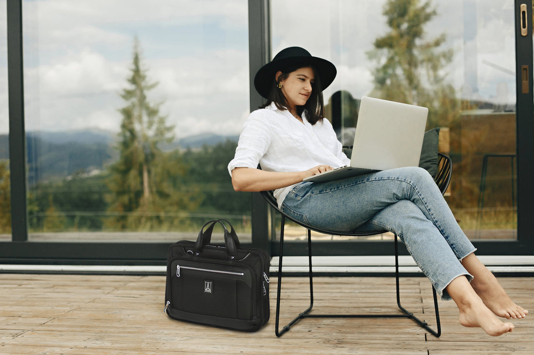 business woman working on laptop outdoors
