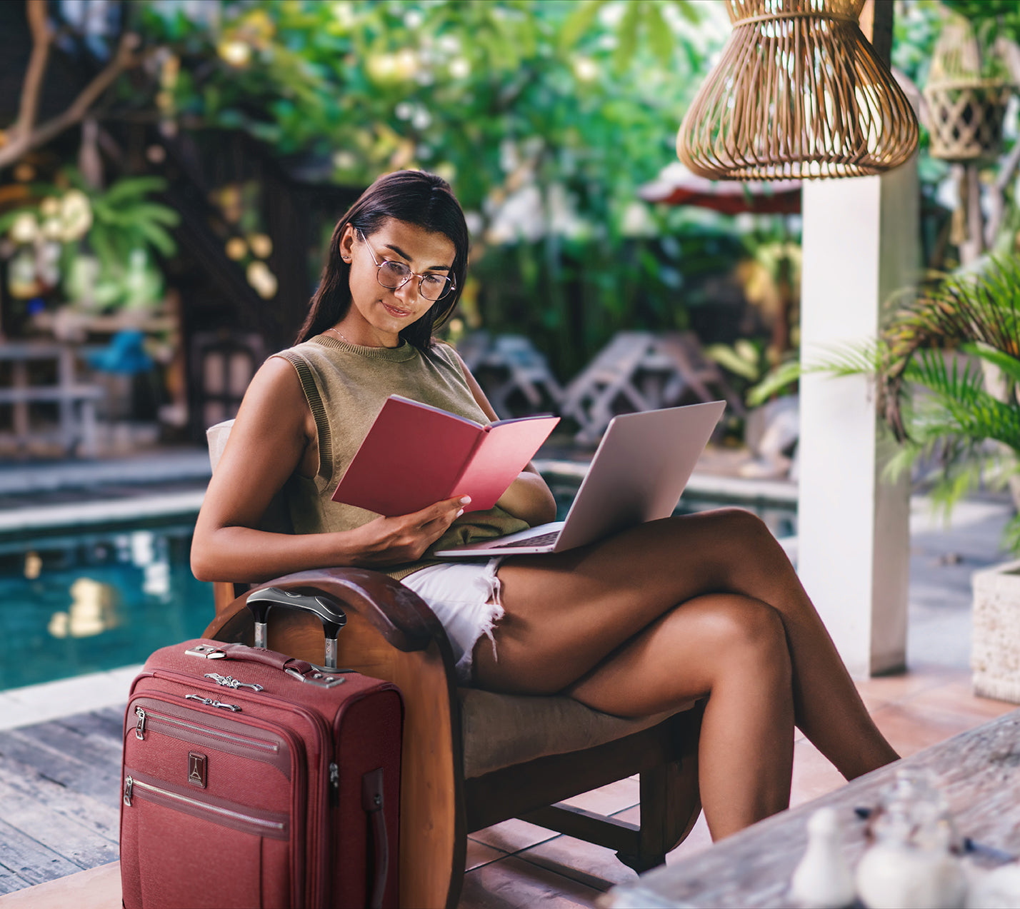 Business woman working poolside