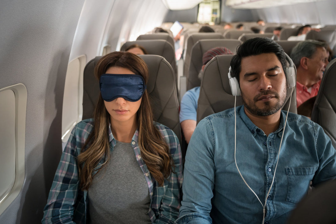 Man and women on a plane sleeping 