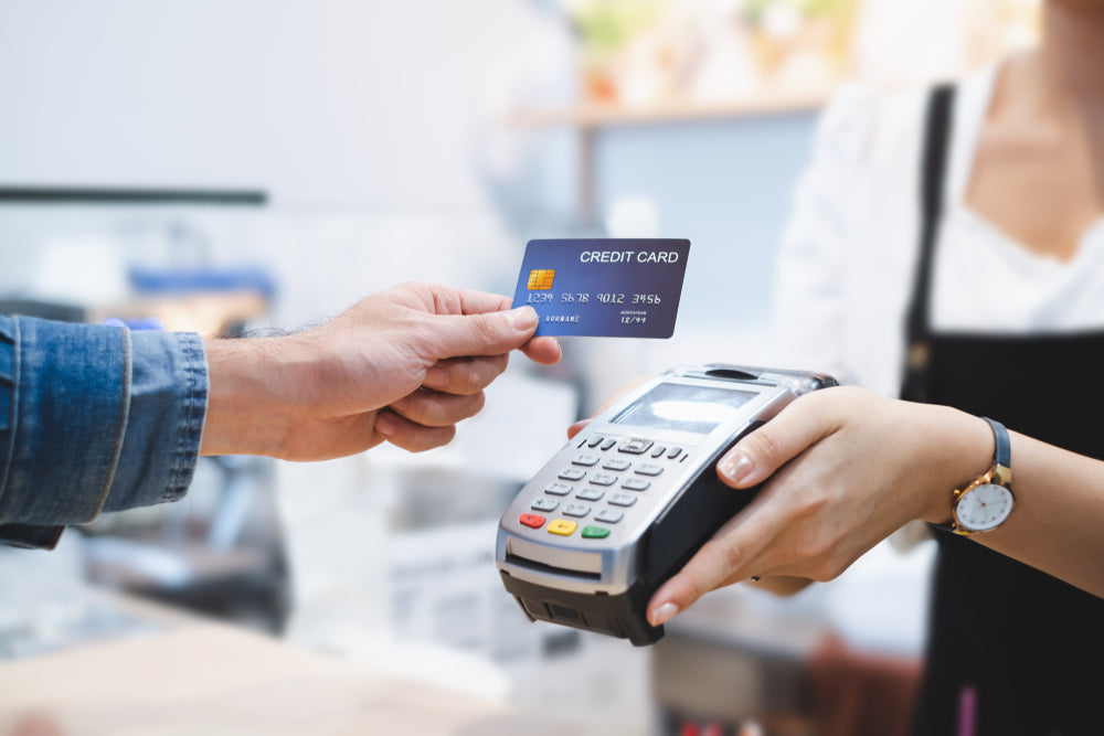 person paying with credit card