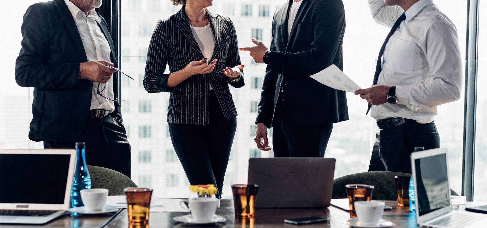 Group of business people gathered around a table