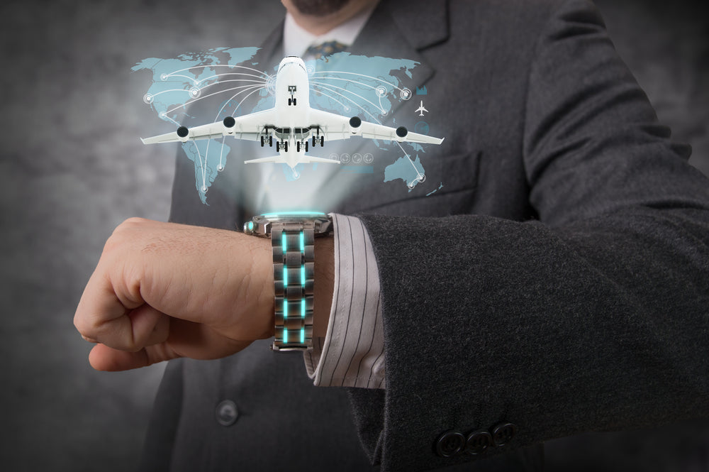 Businessman showing an hologram with his futuristic wristwatch