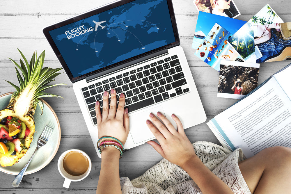 woman using laptop to book a flight.
