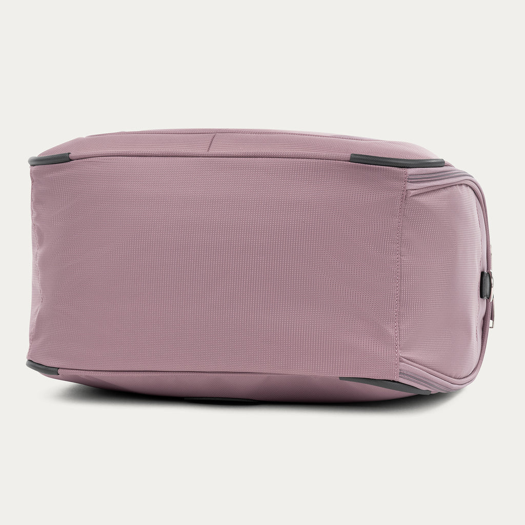 bottom view of the dusty rose pink travelpro maxlite 5 soft tote showing the reinforced base with corner guards for added durability and protection against wear.