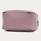 bottom view of the dusty rose pink travelpro maxlite 5 soft tote showing the reinforced base with corner guards for added durability and protection against wear.