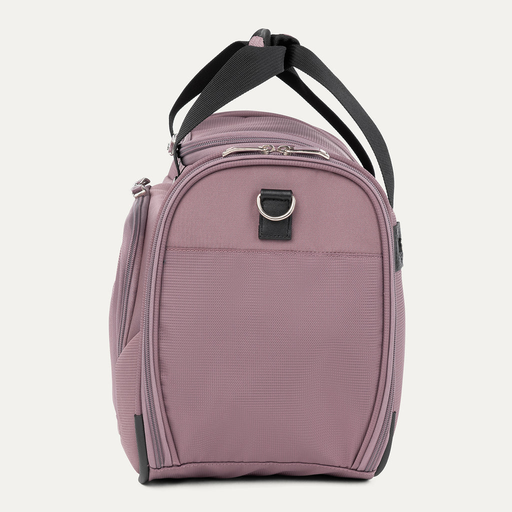 side profile view of the dusty rose pink travelpro maxlite 5 soft tote showing the reinforced side panel, top carry handles, and the metal d-ring for shoulder strap attachment.