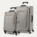 A set of two gray Maxlite brand spinner suitcases, one carry-on size and one checked size, with a four-wheel 360° rotating system and a PowerScope Lite handle.