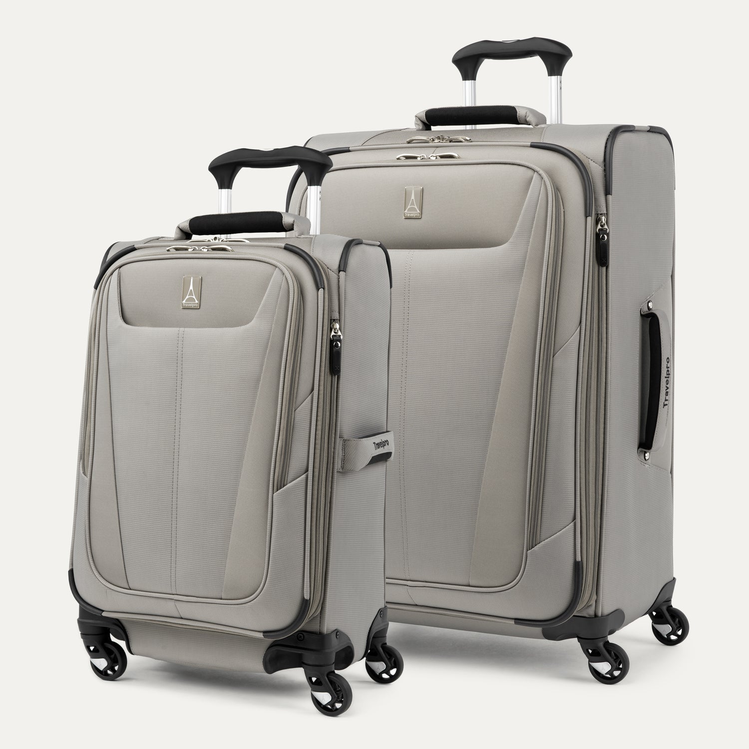 A set of two gray Maxlite brand spinner suitcases, one carry-on size and one checked size, with a four-wheel 360° rotating system and a PowerScope Lite handle.