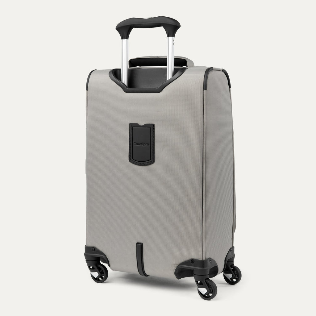 Rear view of Maxlite® 5 Carry-On Spinner in gray, featuring the telescoping handle, protective corner guards, and four spinner wheels for easy mobility.
